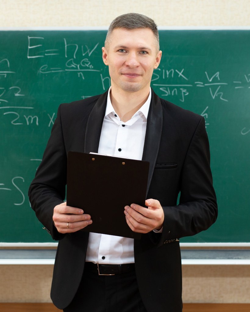 the male teacher used white chalk to write on the lgg7l7w.jpg